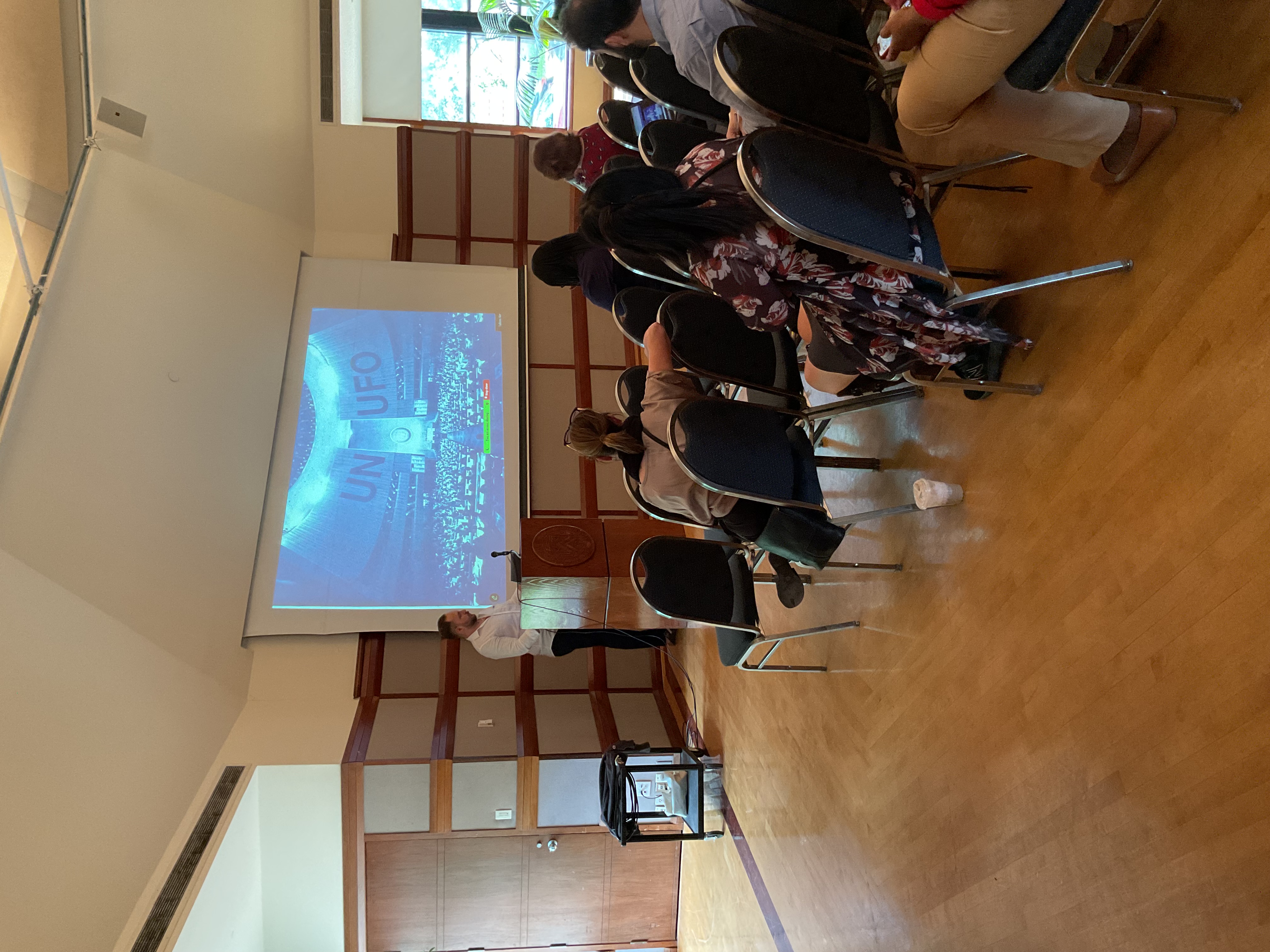 person presenting UFO to audience