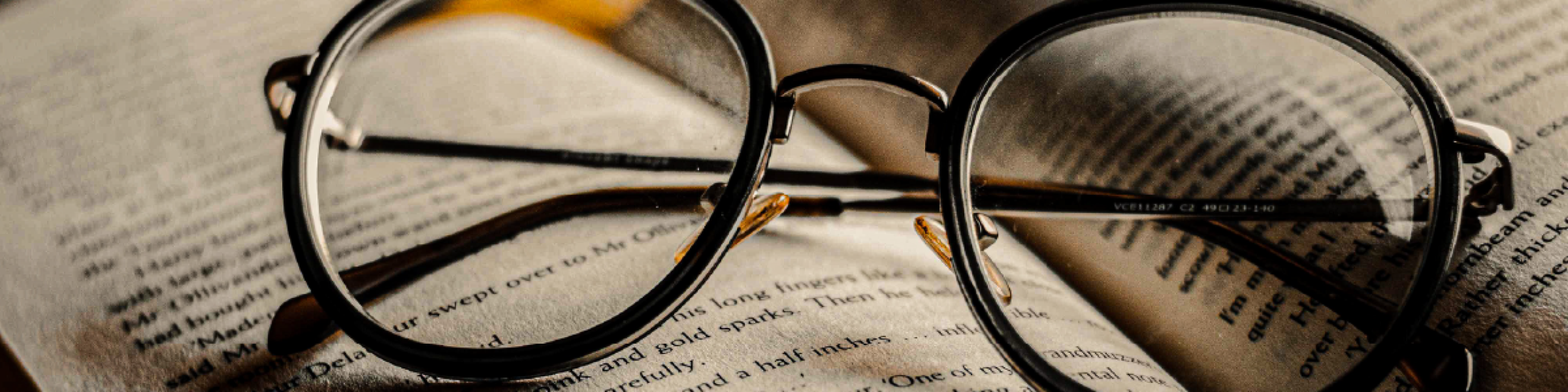 eyeglasses on a book